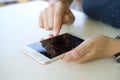 A woman uses a touchscreen smartphone to communicate. Doing business and connecting big data together with buying and selling in Royalty Free Stock Photo