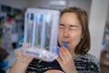 A woman uses a Tri-ball Incentive Spirometer for check his lung function Royalty Free Stock Photo