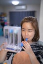 A woman uses a Tri-ball Incentive Spirometer for check his lung function Royalty Free Stock Photo