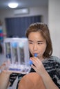 A woman uses a Tri-ball Incentive Spirometer for check his lung function Royalty Free Stock Photo