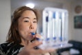 A woman uses a Tri-ball Incentive Spirometer for check his lung function Royalty Free Stock Photo