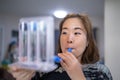 A woman uses a Tri-ball Incentive Spirometer for check his lung function Royalty Free Stock Photo