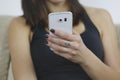 Woman usign new mobile phone with one hand