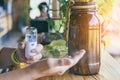 Woman using alcohol nano mist sprayer antiseptic cleaning on her hands protection during Coronavirus pandemic Covid-19.Hand using