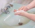 Woman using antibacterial wipes to disinfect her hands close up