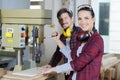 Woman using bench drill with workmate