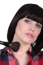 Woman using blusher brush Royalty Free Stock Photo