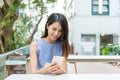 Woman using cellphone in outdoor cafe Royalty Free Stock Photo