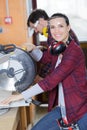 woman using circular saw