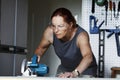 A woman using a circular saw. Royalty Free Stock Photo