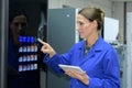 Woman using coffee vending machine Royalty Free Stock Photo