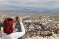 Woman using coin operated binoculars Royalty Free Stock Photo