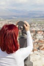 Woman using coin operated binoculars Royalty Free Stock Photo