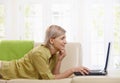 Woman using computer at home Royalty Free Stock Photo