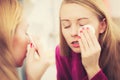 Woman using cotton pad to remove make up Royalty Free Stock Photo