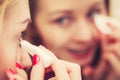 Woman using cotton pad to remove make up Royalty Free Stock Photo