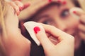 Woman using cotton pad to remove make up Royalty Free Stock Photo