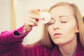 Woman using cotton pad to remove make up Royalty Free Stock Photo