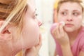 Woman using cotton pad to remove make up Royalty Free Stock Photo