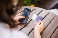 woman using credit card and smartphone during slide screen for finding product Royalty Free Stock Photo