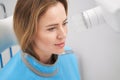 Woman using dental scanning machine in stomatology clinic Royalty Free Stock Photo