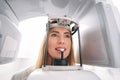 Woman using dental x-ray machine in stomatology clinic Royalty Free Stock Photo