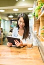 Woman using digital tablet computer in cafe Royalty Free Stock Photo