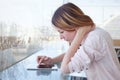 Woman using digital tablet gadget in modern interior, checking email