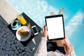 Woman using digital tablet while sitting in swimming pool Royalty Free Stock Photo