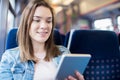 Young Woman Using Digital Tablet During Train Journey Royalty Free Stock Photo
