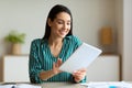 Woman Using Tablet At Workplace Browsing Internet Sitting In Office Royalty Free Stock Photo