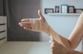 Woman using elastic bandage with hand,Female putting bandage on his injured hand Royalty Free Stock Photo