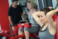 woman using exercise equipment in gym Royalty Free Stock Photo