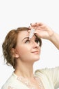 Woman using eye drops. Medicine treatment. Eyecare human problem Royalty Free Stock Photo