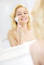 Woman using face cleansing brush Royalty Free Stock Photo