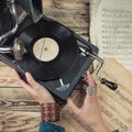 Woman using gramophone. Royalty Free Stock Photo