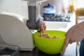 Woman using grinder for preparation of minced meat in kitchen Royalty Free Stock Photo