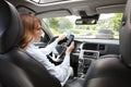 Woman using handy in her car Royalty Free Stock Photo