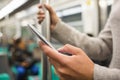 Woman using her cell phone in Subway Royalty Free Stock Photo