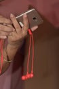 Woman using her cell phone in subway, she listens to music with earphone Royalty Free Stock Photo