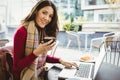 Woman using her laptop and drinking coffee Royalty Free Stock Photo