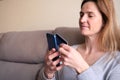 Woman is Using her Phone at Home for Shopping Online Royalty Free Stock Photo