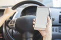 Woman using her smartphone open mobile application navigation or gps in her car. Blurred car interior background. Viewing location Royalty Free Stock Photo