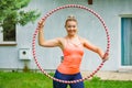 Young woman with hoola hoop outdoors Royalty Free Stock Photo