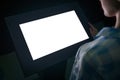 Woman using interactive white empty touchscreen display kiosk at exhibition Royalty Free Stock Photo