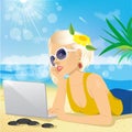 Woman using laptop on the beach