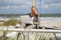 Woman Using Laptop On Boat At The Beach Royalty Free Stock Photo