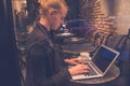 Woman using laptop in cafe