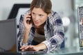 woman using laptop and cell phone Royalty Free Stock Photo