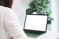 Woman using laptop computer with blank screen for mock up template background, people business technology and lifestyle background Royalty Free Stock Photo